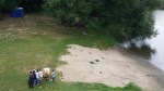 an artist painting and onlookers watching